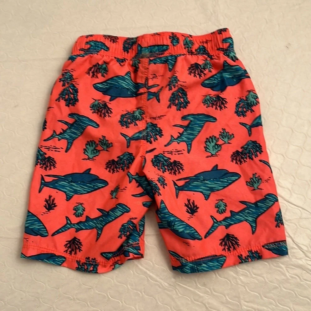 Old Navy coral and teal shark print lined swim trunks